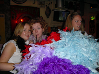 Cheeky grins from behind the mountain of feathers.