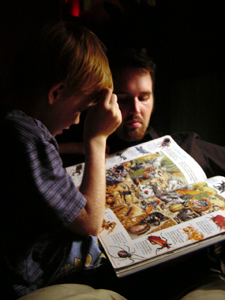 Mark and Aden are reading a book about bugs.